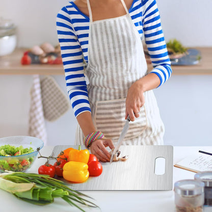 cutting veggies on stainless steel board